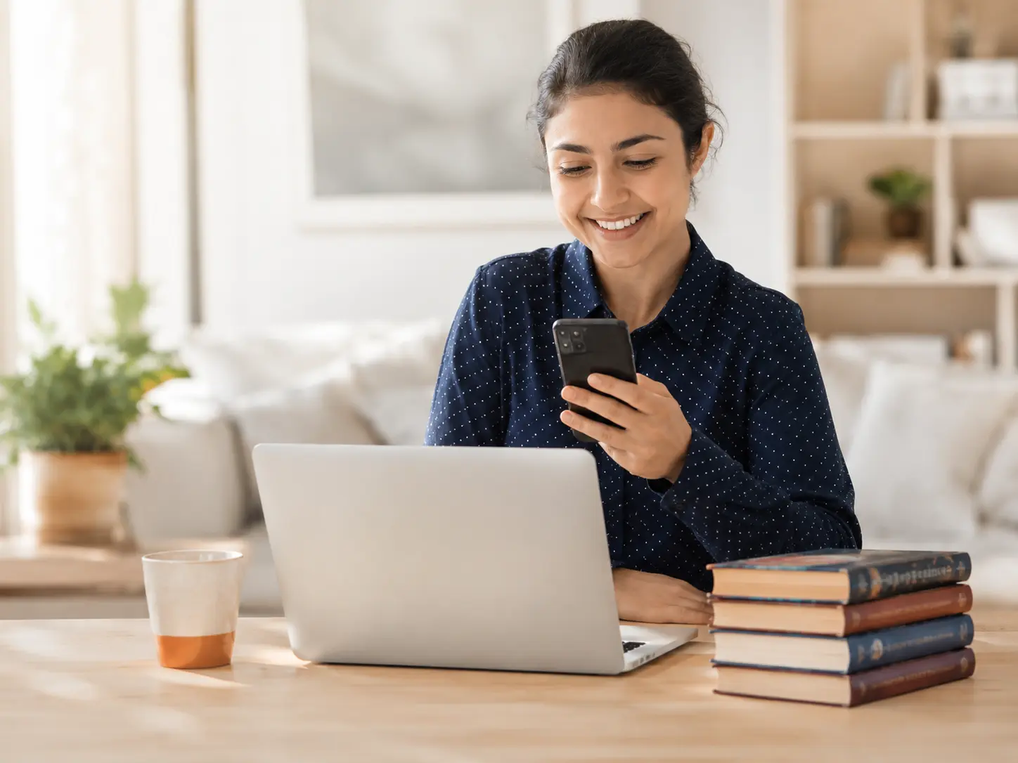 A seller checking a book trade on a laptop at home